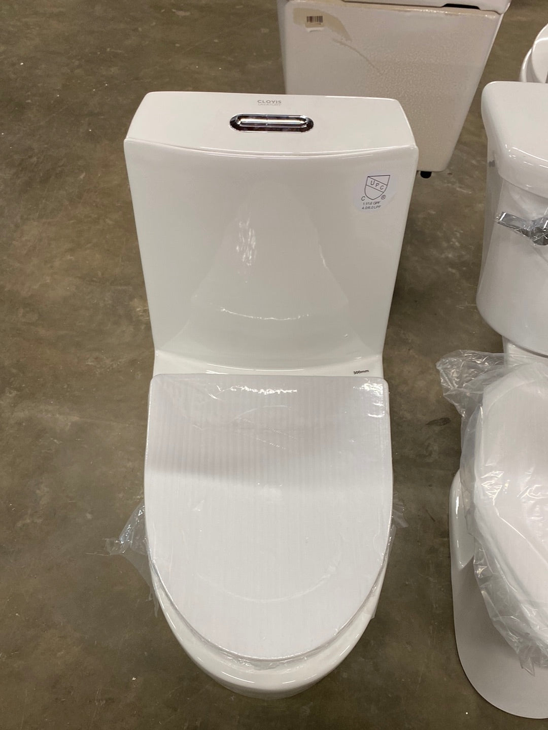 Ultraluxe 12 in. Rough-In 1-piece 1/1.6 GPF Dual Flush Elongated Toilet in White, Seat Included