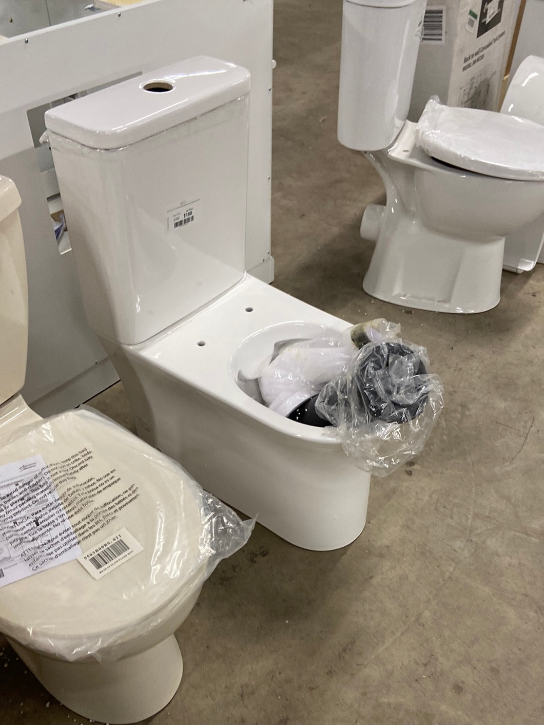Calice 2-piece 0.8/1.28 GPF Dual Flush Elongated Toilet in White Seat Included