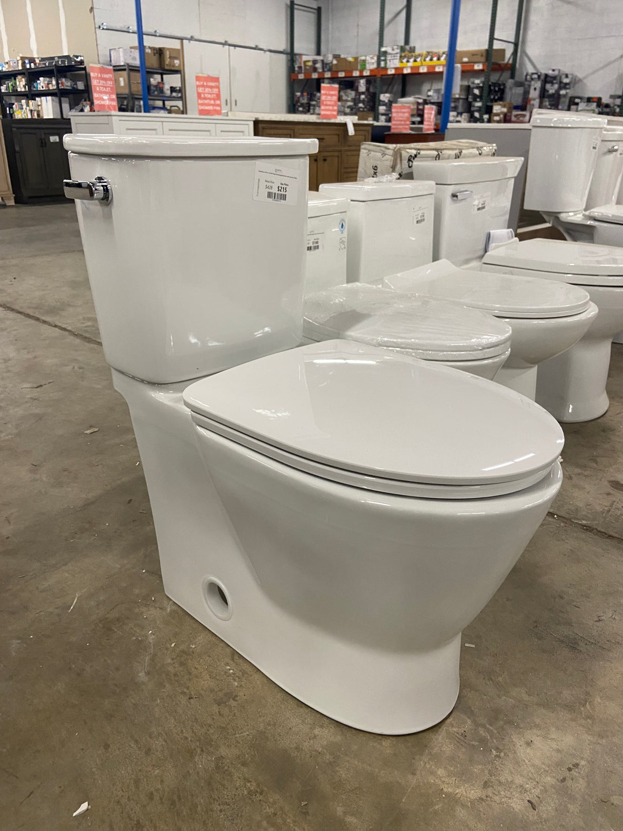 Aspirations 2-Piece 1.28 GPF Single Flush Elongated Skirted Toilet with Seat in White
