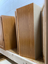Load image into Gallery viewer, Hampton 24 in. W x 12 in. D x 30 in. H Assembled Diagonal Corner Wall Kitchen Cabinet in Medium Oak
