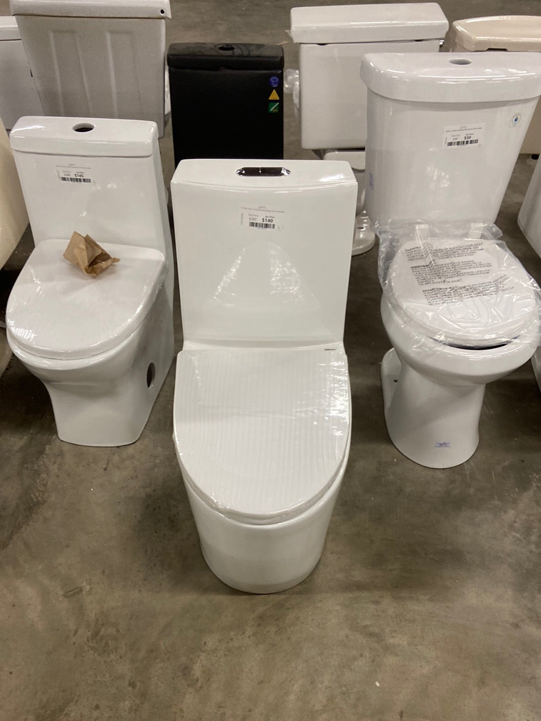 St. Tropez 1-Piece 1.1/1.6 GPF Dual Flush Elongated Toilet in Glossy White