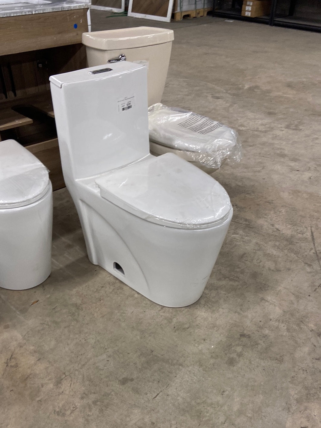 Buxton 1-Piece 1.6 GPF/1.1 GPF Dual Flush Elongated Toilet in White