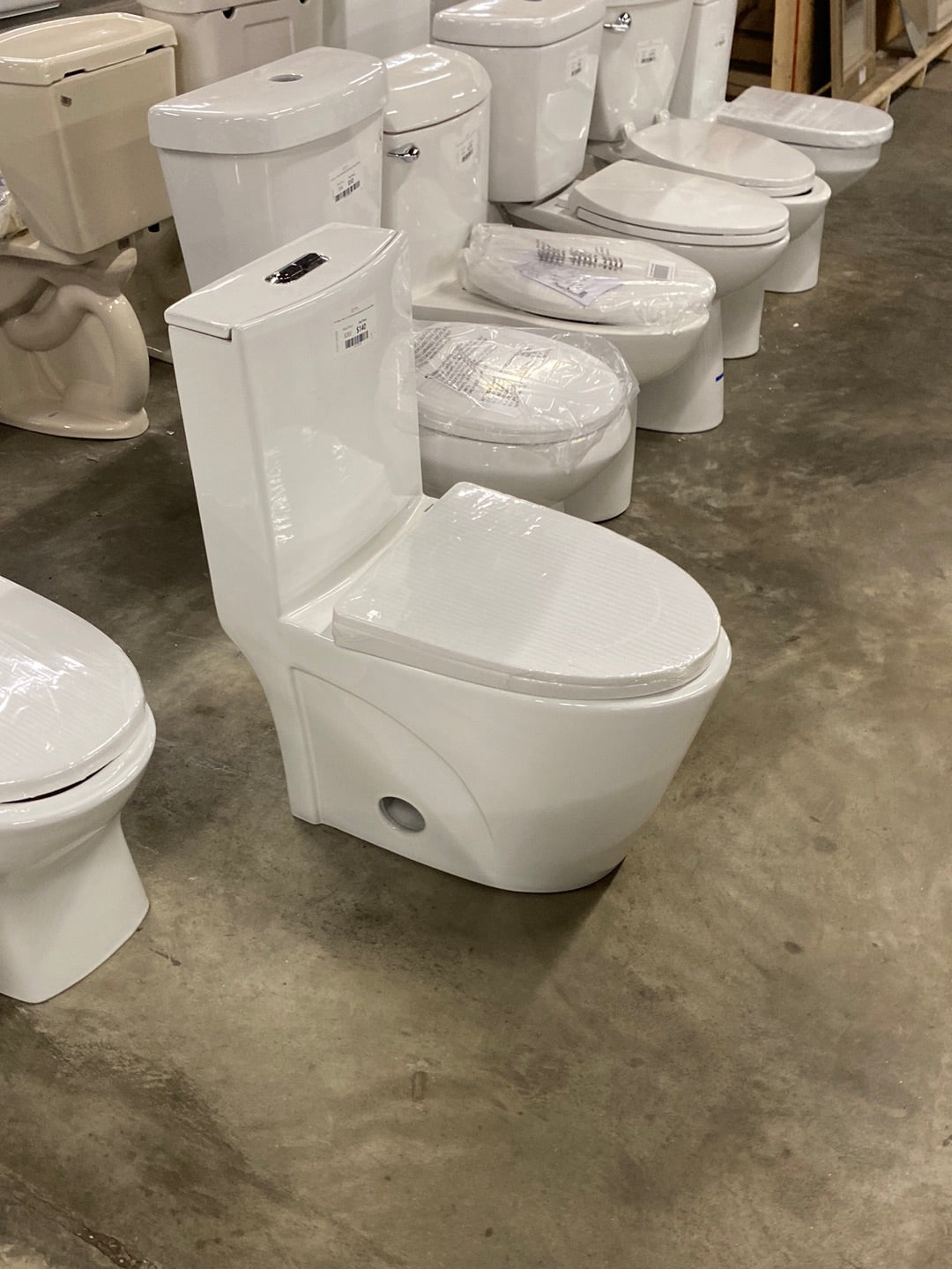 St. Tropez 1-Piece 1.1/1.6 GPF Dual Flush Elongated Toilet in Glossy White