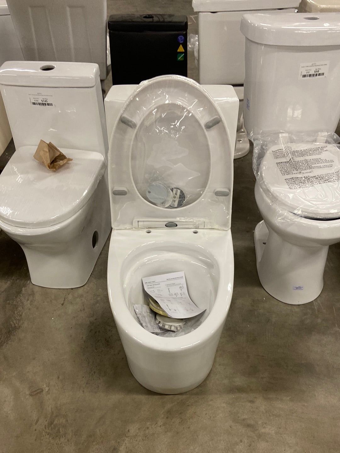 St. Tropez 1-Piece 1.1/1.6 GPF Dual Flush Elongated Toilet in Glossy White