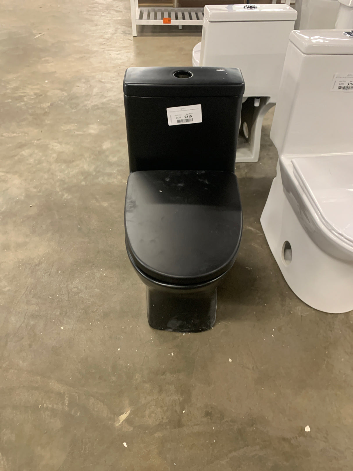 Sublime II 1-Piece 1.1/1.6 GPF Toilet Dual Flush Round Toilet in Matte Black Seat Included