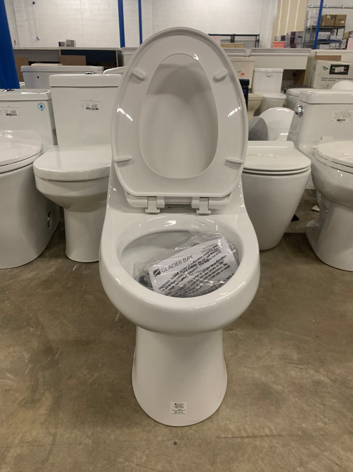 1-piece 1.1 GPF/1.6 GPF High Efficiency Dual Flush Elongated Toilet in White Slow-Close, Seat Included