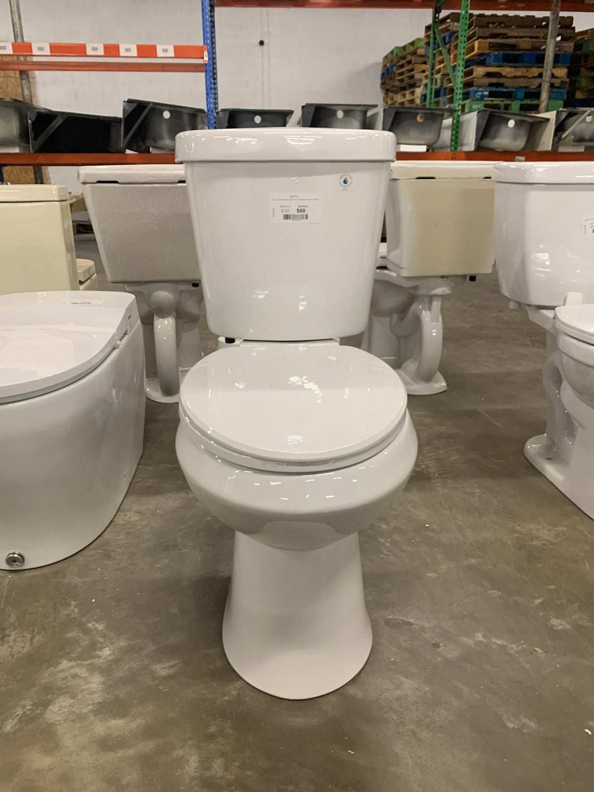 2-piece 1.1 GPF/1.6 GPF High Efficiency Dual Flush Complete Elongated Toilet in White, Seat Included