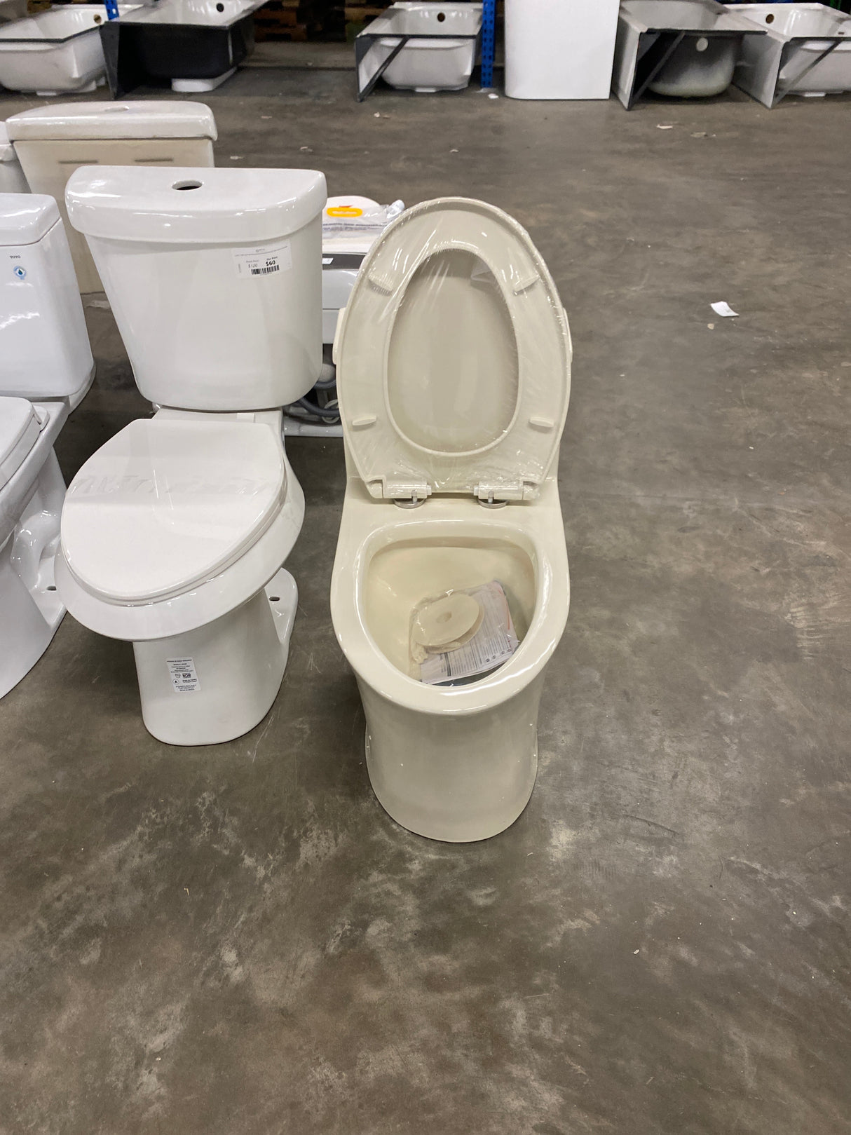 1-piece 0.8/1.28 GPF High Efficiency Dual Flush Elongated Toilet in Biscuit, Seat Included