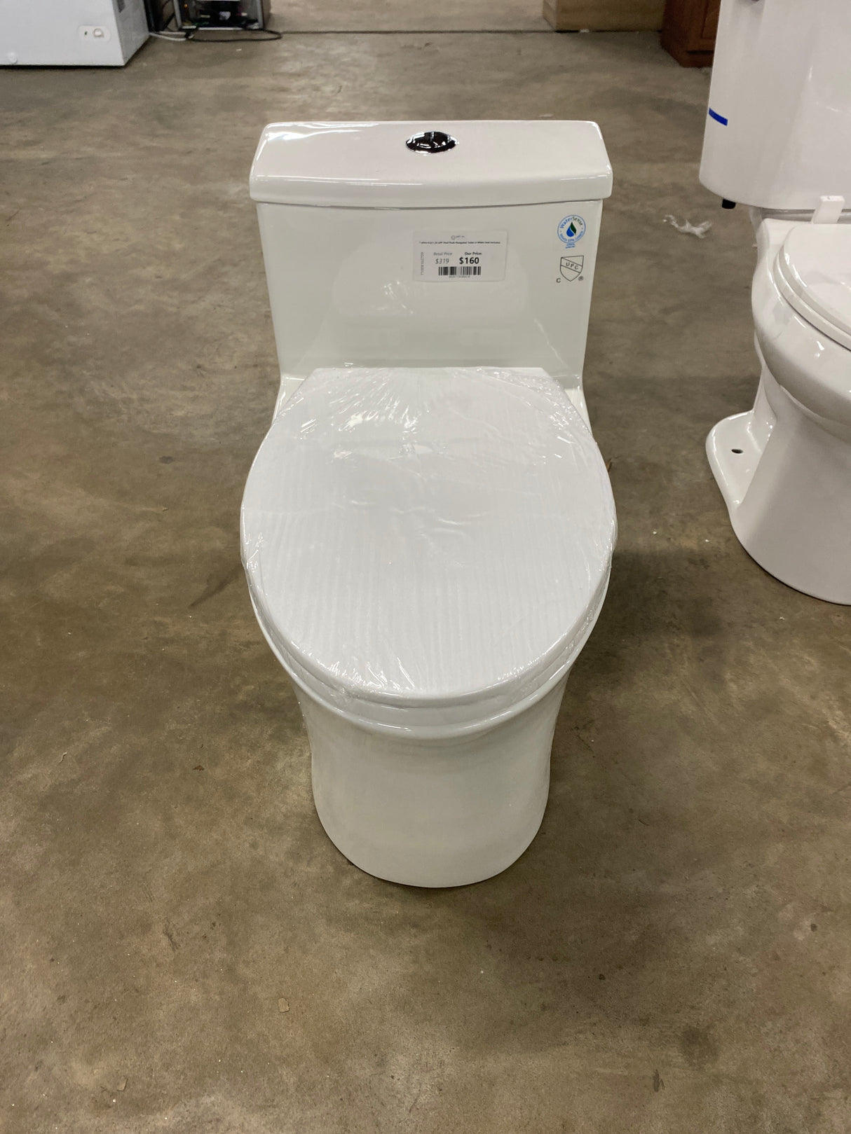 1-piece 0.8/1.28 GPF Dual Flush Elongated Toilet in White Seat Included