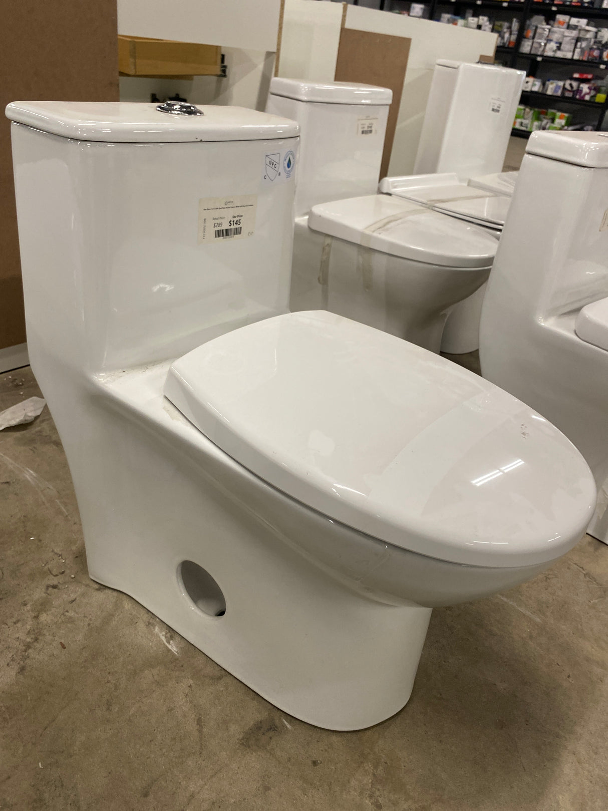 One-Piece 1.1/1.6 GPF Dual Flush Round Toilet in White Soft Close Seat Included