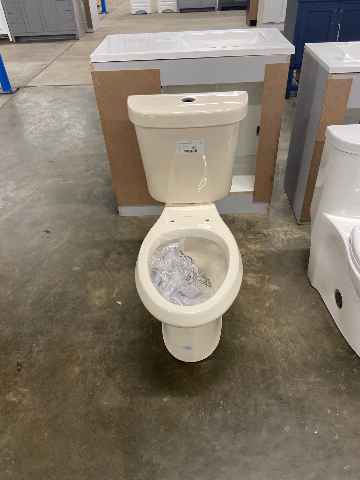 2-Piece 1.1 GPF/1.6 GPF High Efficiency Dual Flush Elongated Toilet in Bone, Seat Included