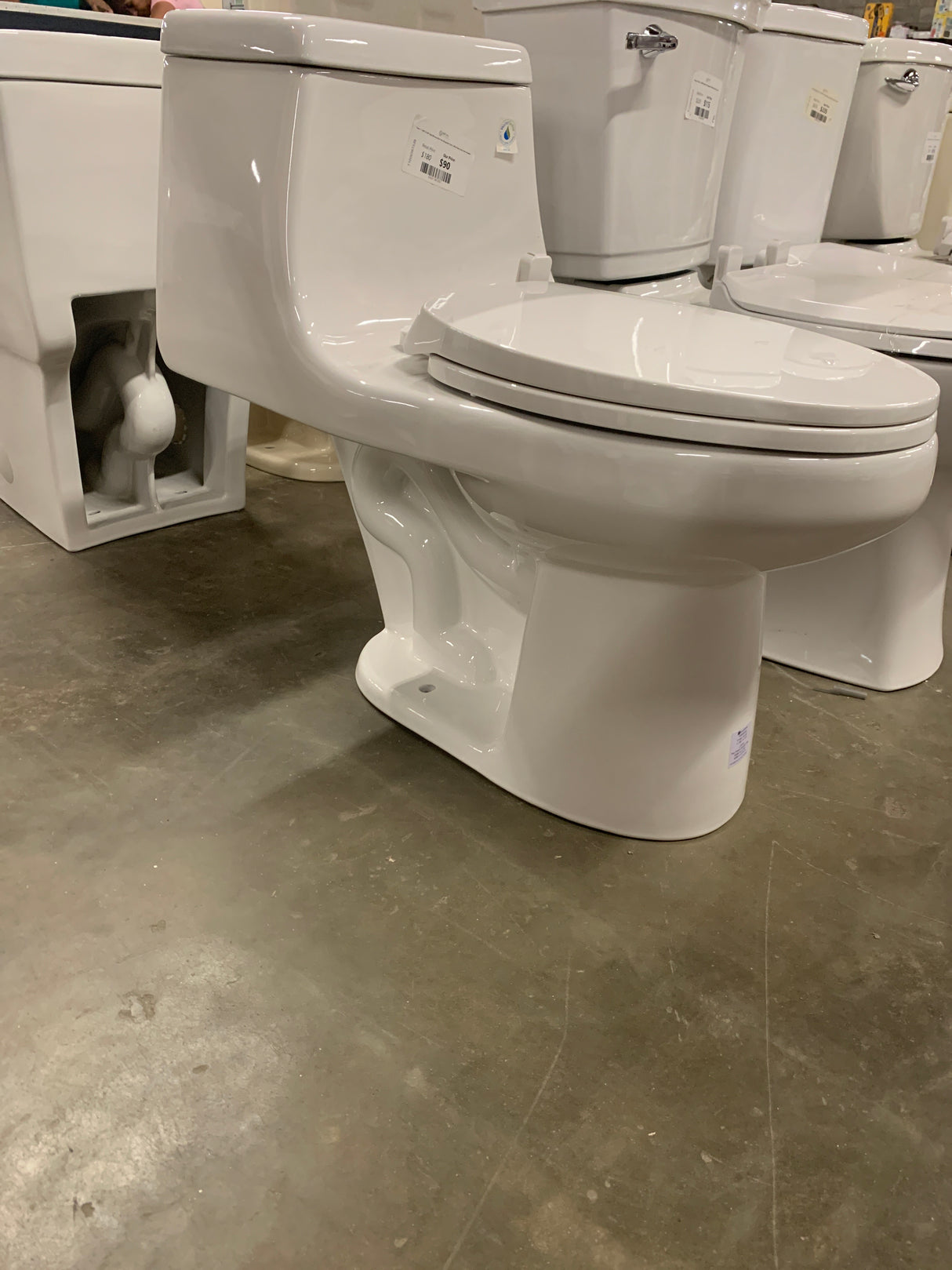 1-piece 1.1 GPF/1.6 GPF High Efficiency Dual Flush Elongated Toilet in White Slow-Close, Seat Included