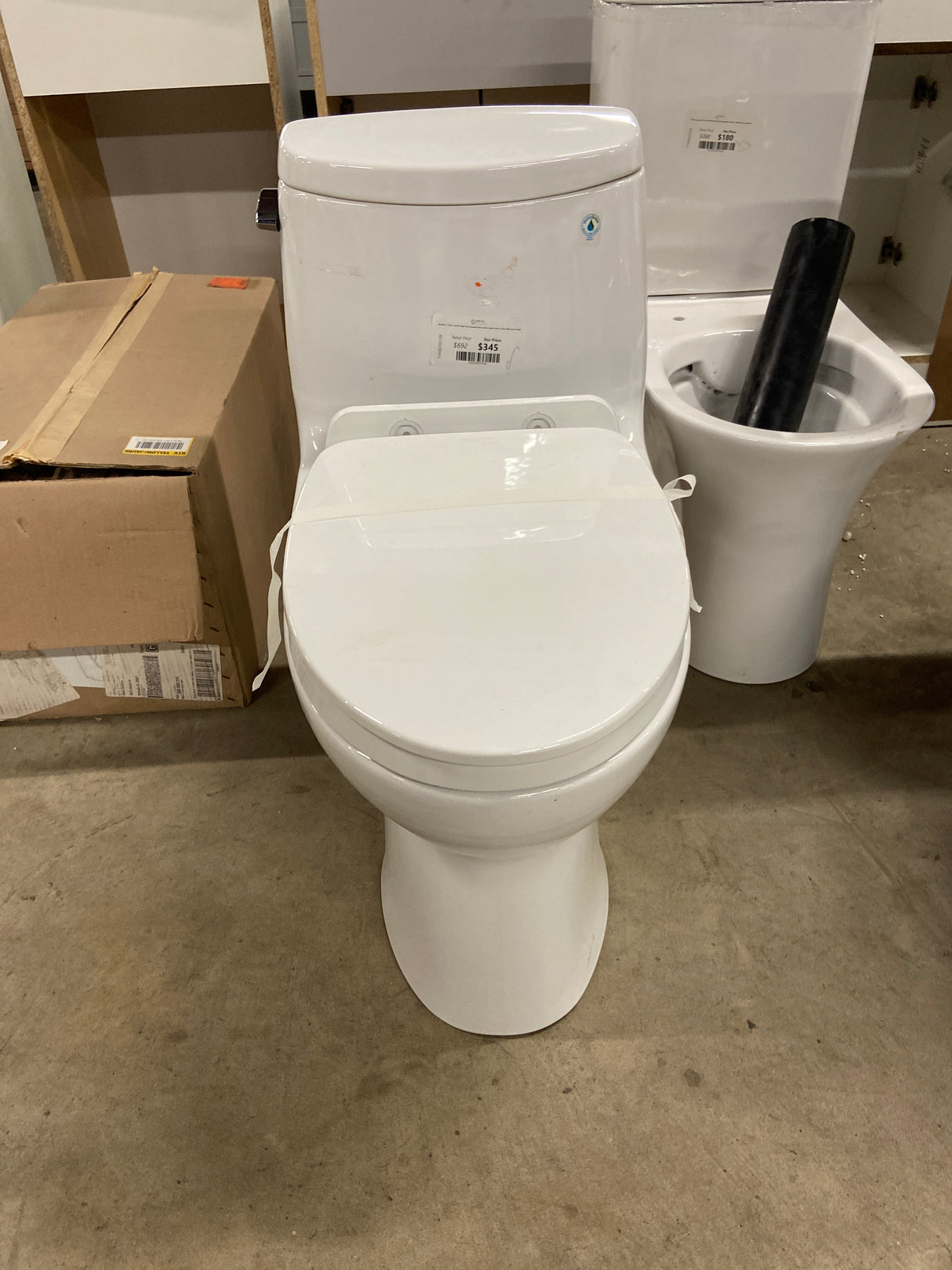 UltraMax II 1-Piece 1.28 GPF Single Flush Elongated ADA Comfort Height Toilet in Cotton White Seat Included