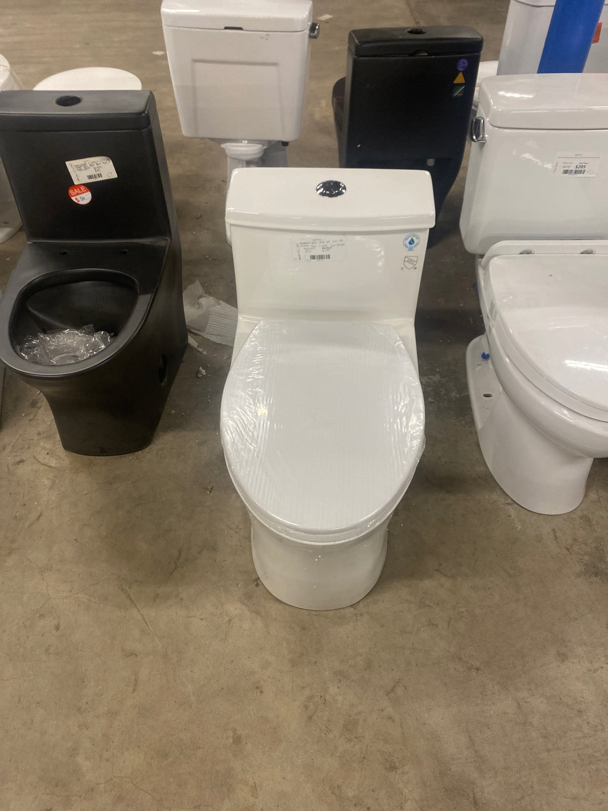 1-piece 0.8/1.28 GPF Dual Flush Elongated Toilet in White Seat Included