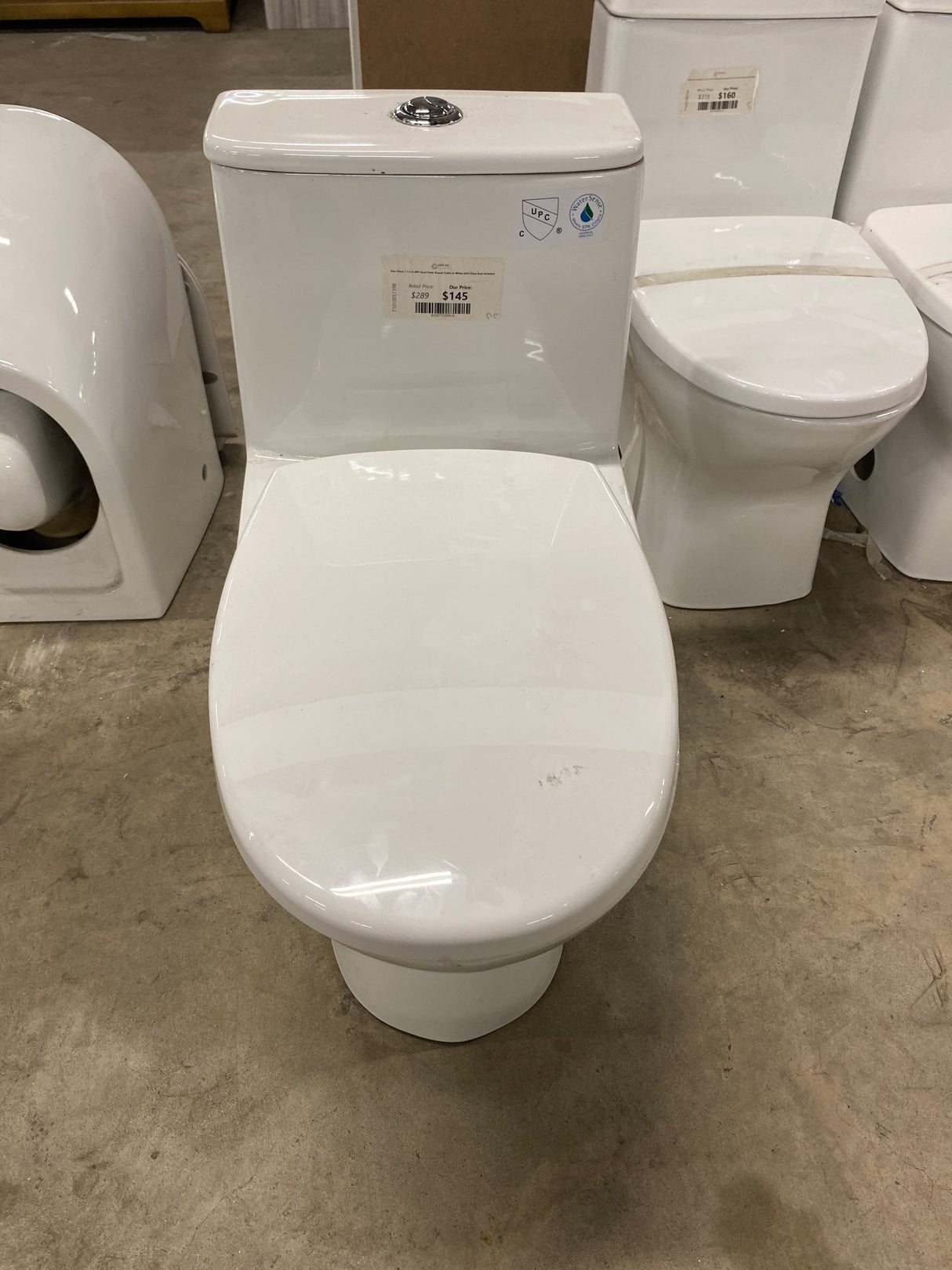 One-Piece 1.1/1.6 GPF Dual Flush Round Toilet in White Soft Close Seat Included