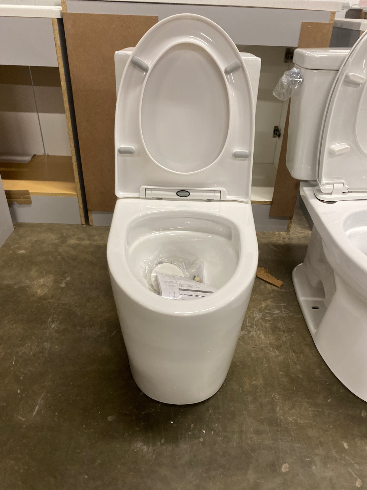 St. Tropez 1-Piece 1.28 GPF Single Flush Elongated Toilet in White Seat Included