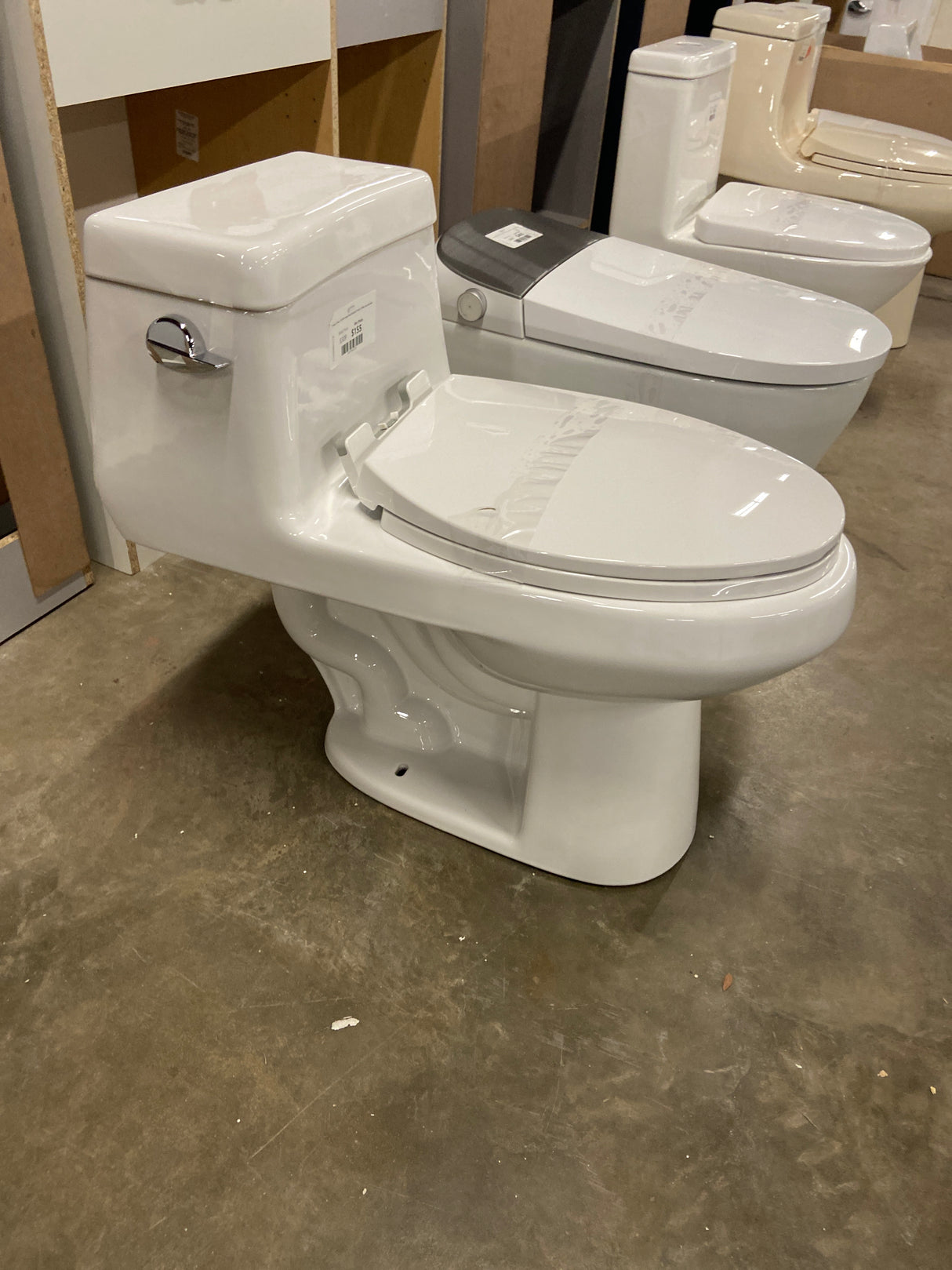 Colony 1-Piece 1.28 GPF Single Flush Elongated Toilet in White Seat Included