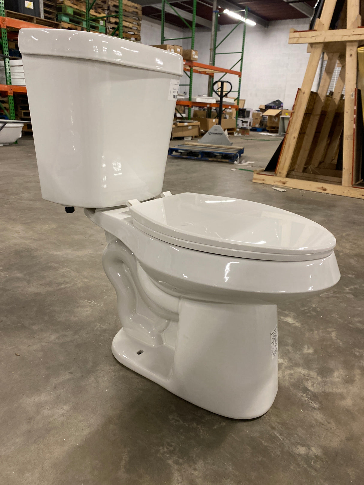 2-piece 1.1 GPF/1.6 GPF High Efficiency Dual Flush Complete Elongated Toilet in White, Seat Included