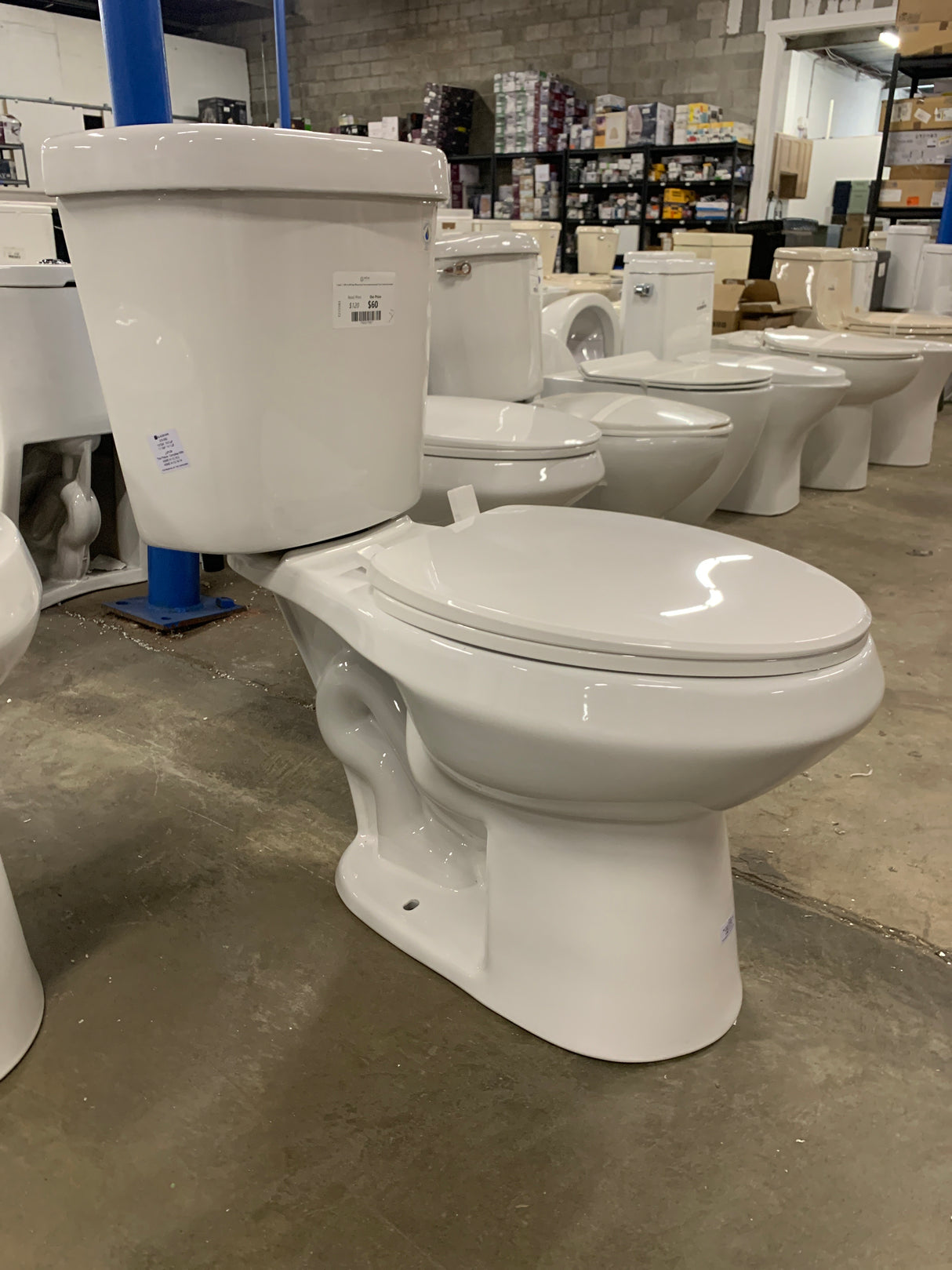 2-piece 1.1 GPF/1.6 GPF High Efficiency Dual Flush Complete Elongated Toilet in White, Seat Included