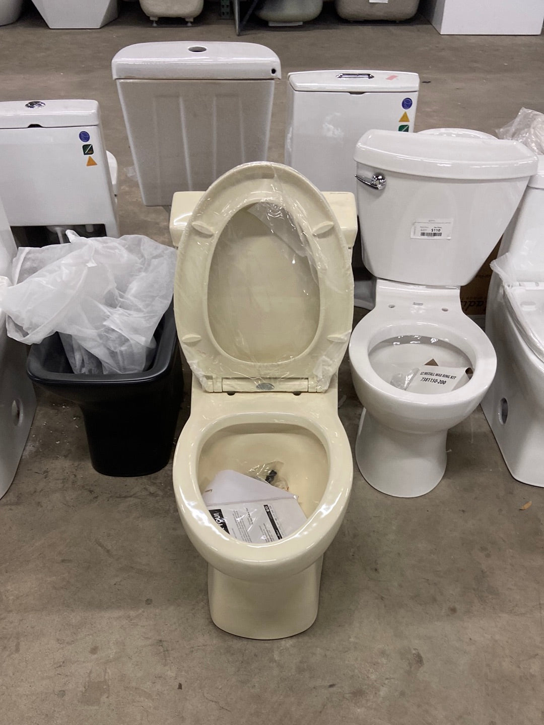 Classe 1-Piece 1.28 GPF Single Flush Elongated Toilet with Front Flush Handle in Bisque Seat Included