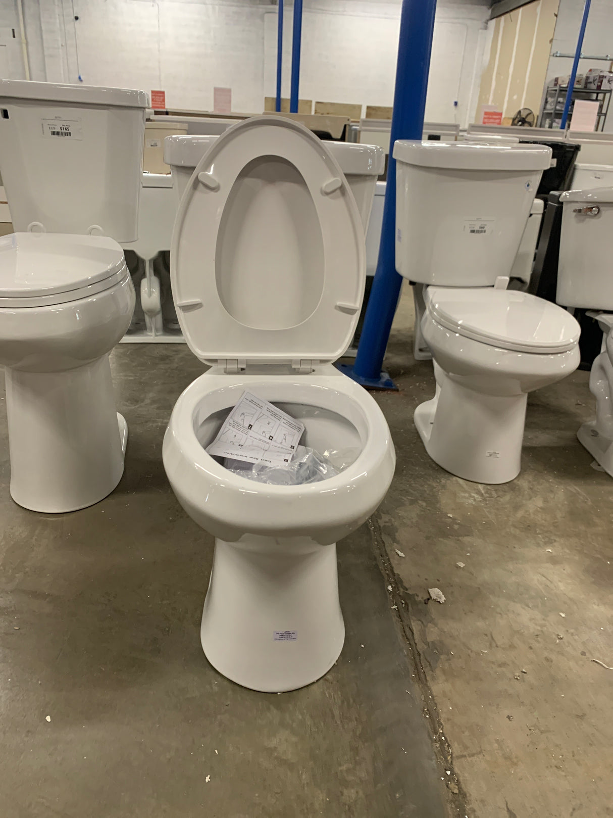 2-piece 1.1 GPF/1.6 GPF High Efficiency Dual Flush Complete Elongated Toilet in White, Seat Included