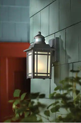 Port Oxford 10.625 in. 1-Light Oil Rubbed Chestnut Motion Sensing Outdoor Wall Mount Lantern