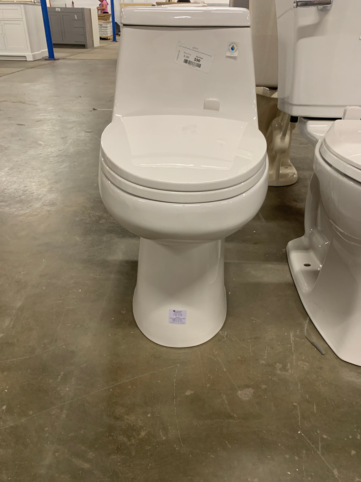 1-piece 1.1 GPF/1.6 GPF High Efficiency Dual Flush Elongated Toilet in White Slow-Close, Seat Included