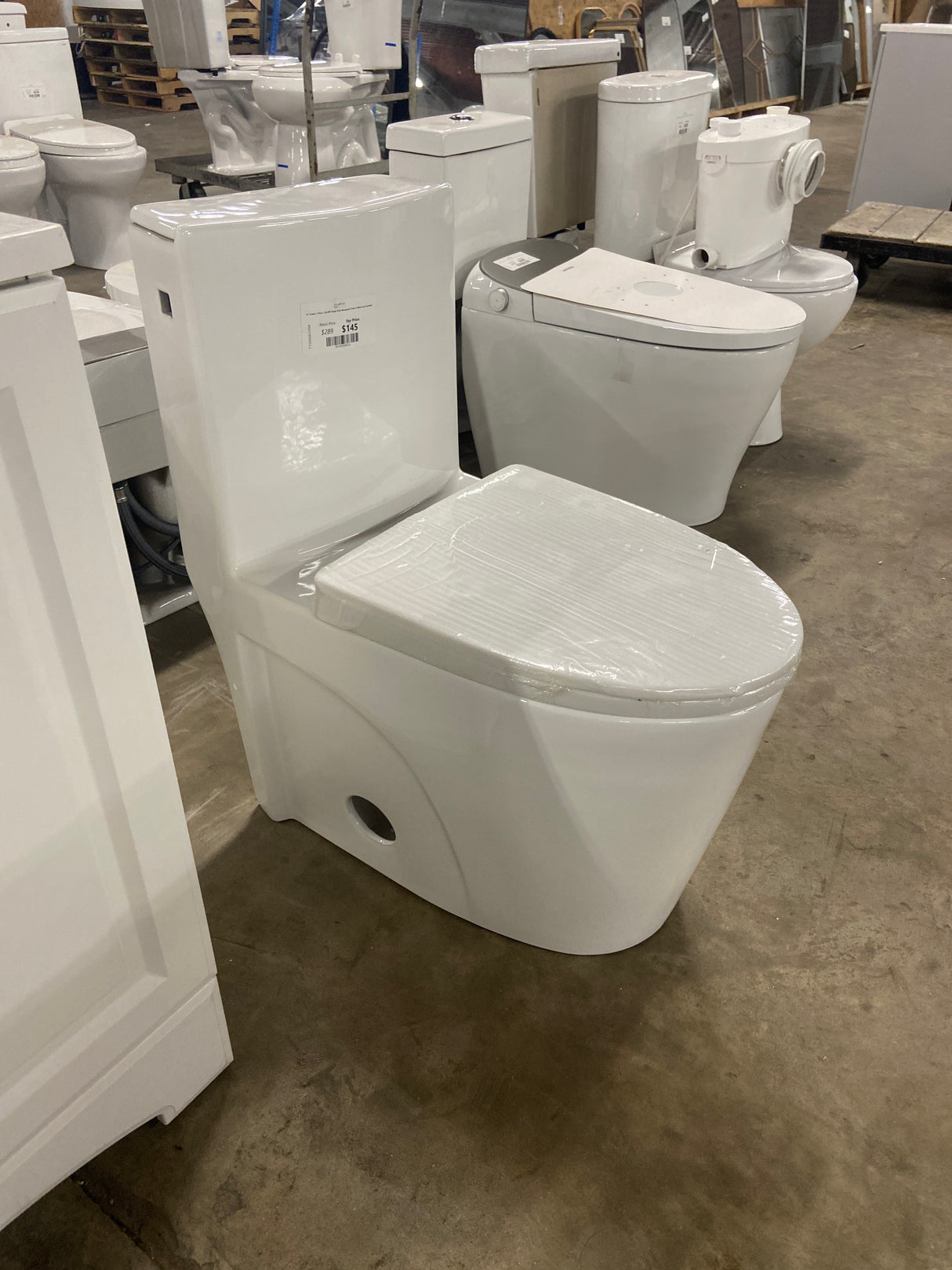 St. Tropez 1-Piece 1.28 GPF Single Flush Elongated Toilet in White Seat Included