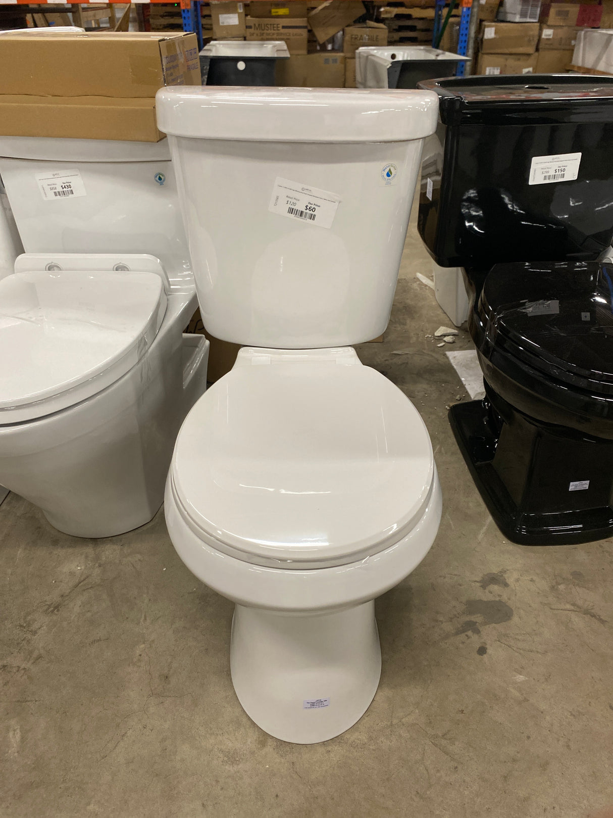 2-piece 1.1 GPF/1.6 GPF High Efficiency Dual Flush Complete Elongated Toilet in White, Seat Included