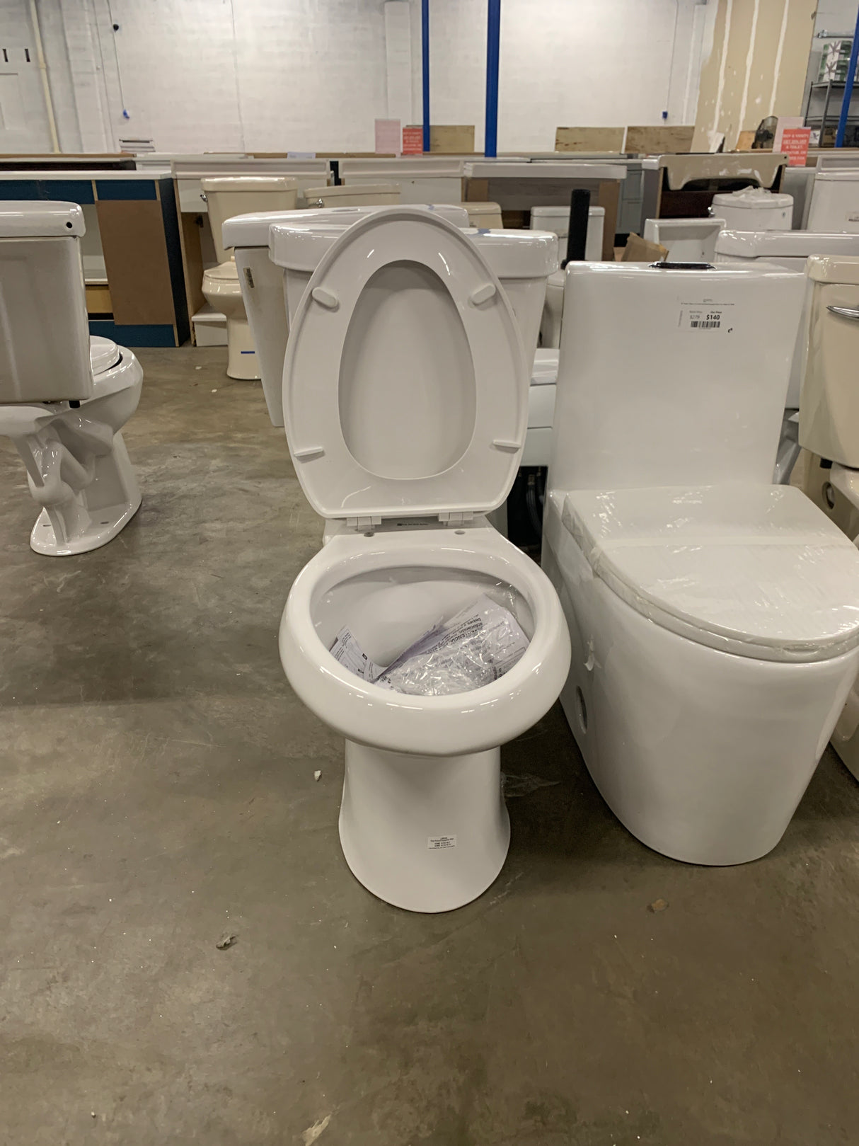 2-piece 1.1 GPF/1.6 GPF High Efficiency Dual Flush Complete Elongated Toilet in White, Seat Included