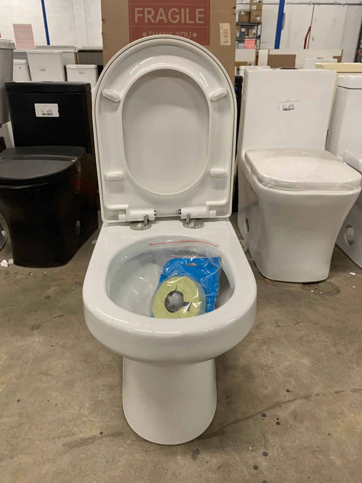 One-Piece 1.1/1.6 GPF Dual Flush Round Toilet in White Soft Close Seat Included