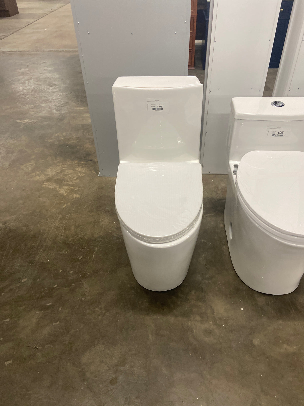 St. Tropez 1-Piece 1.28 GPF Single Flush Elongated Toilet in White Seat Included