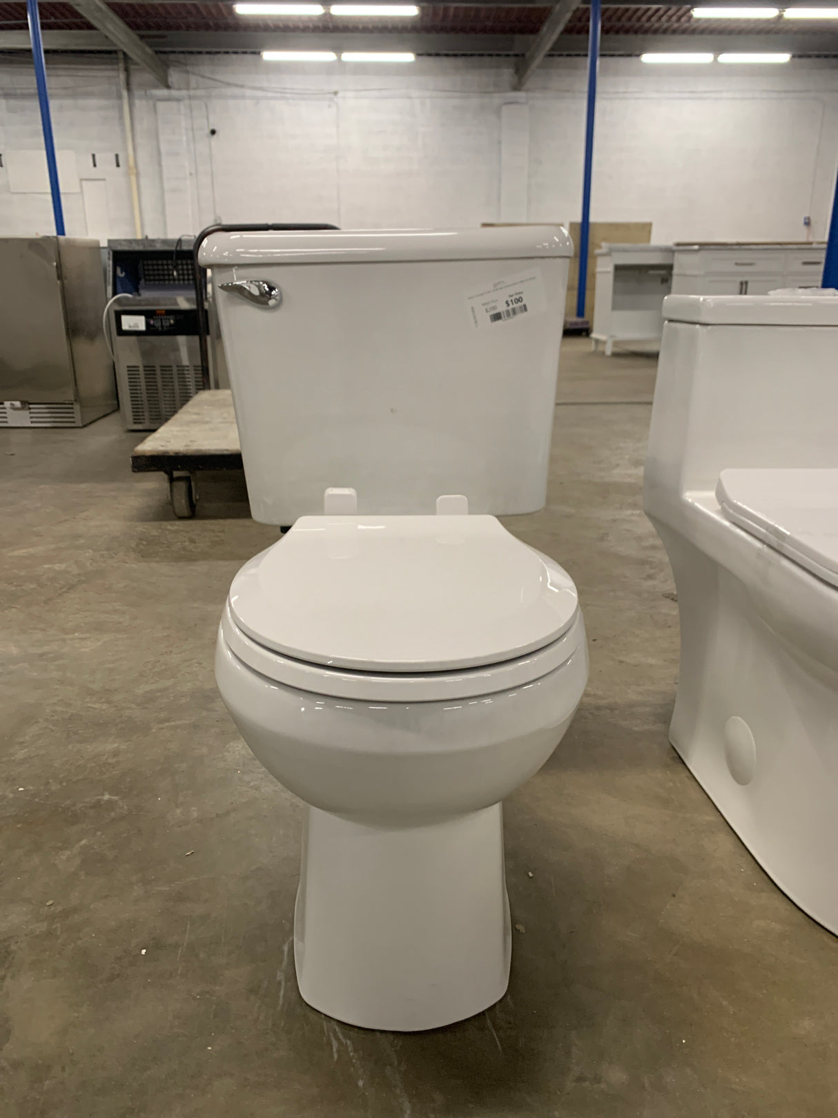 Reliant 10 in. Rough-In 2-Piece 1.28 GPF Single Flush Round Toilet in White, Seat Included