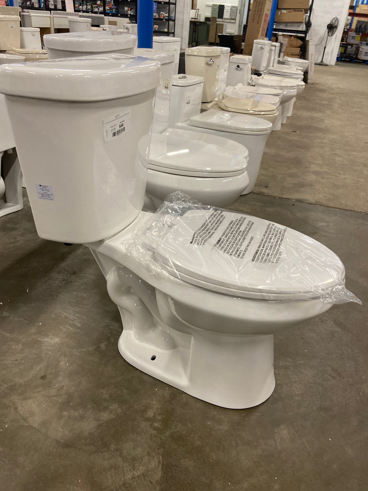 2-piece 1.1 GPF/1.6 GPF High Efficiency Dual Flush Complete Elongated Toilet in White, Seat Included