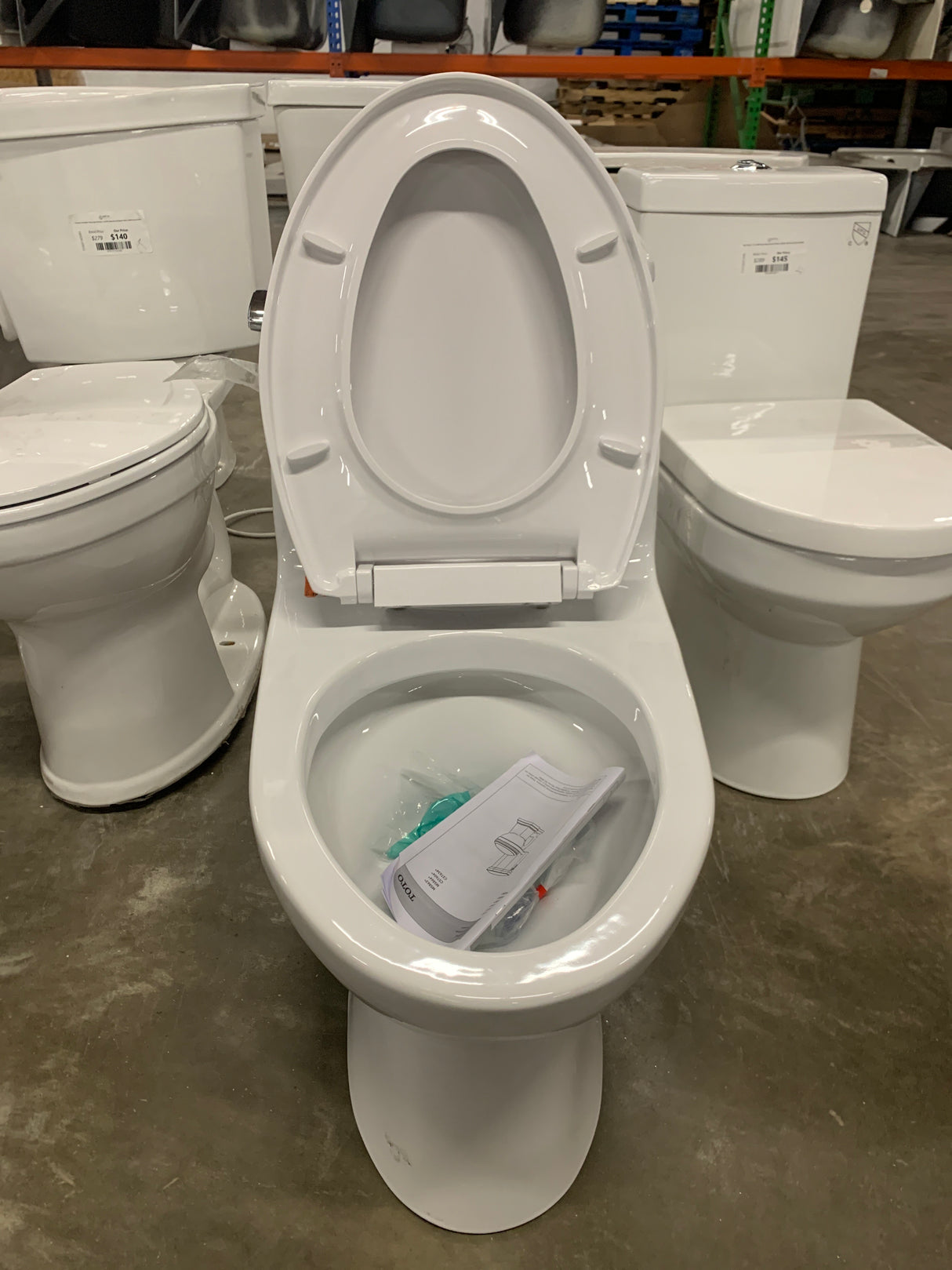 Eco UltraMax 1-Piece 1.28 GPF Single Flush Elongated Standard Height Toilet in Cotton White, SoftClose Seat Included