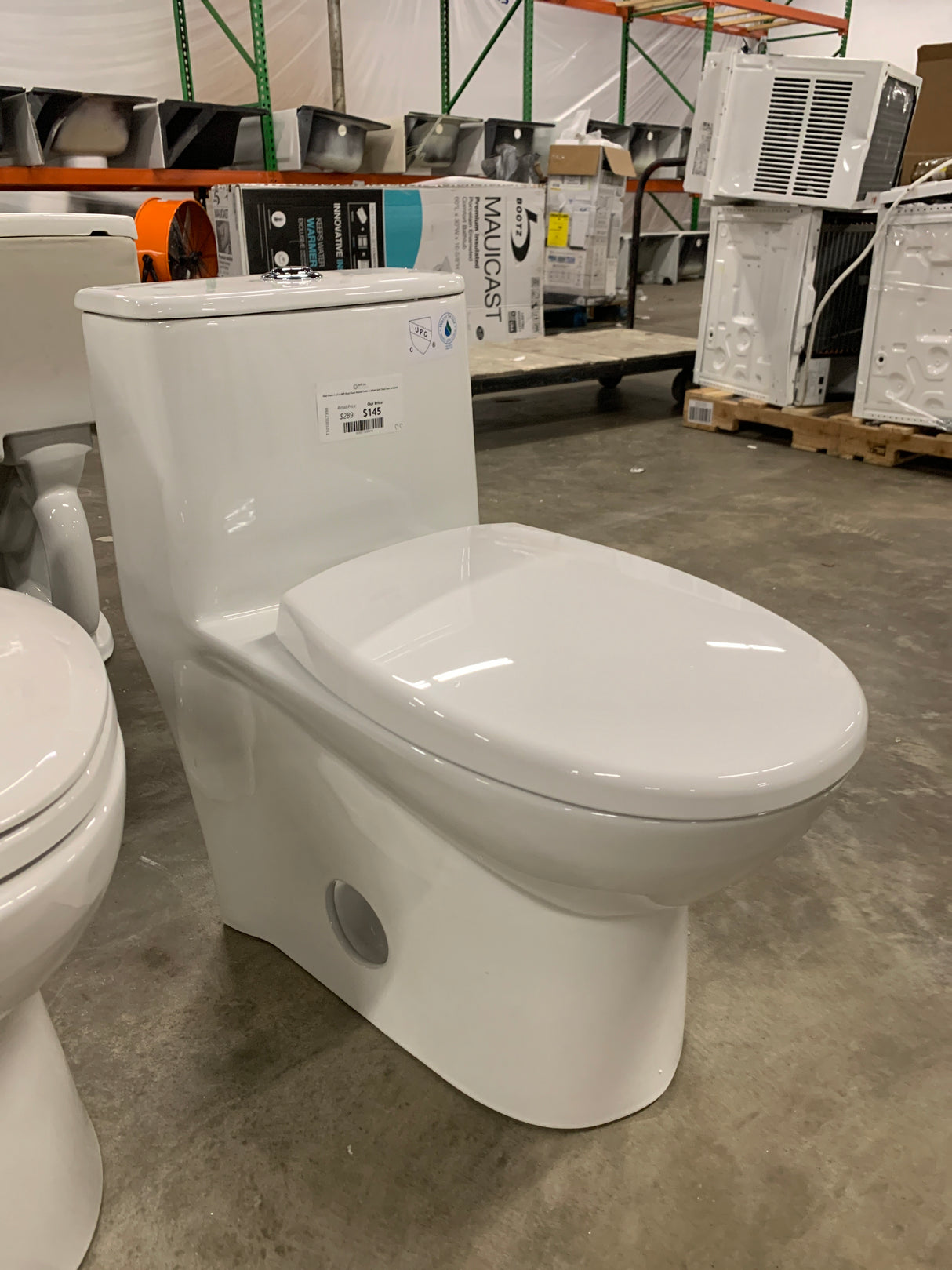 One-Piece 1.1/1.6 GPF Dual Flush Round Toilet in White Soft Close Seat Included