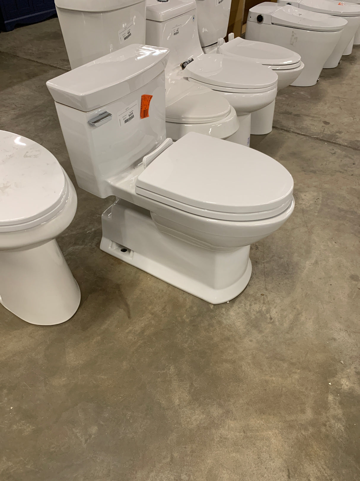 Eco Soiree 12 in. Rough In One-Piece 1.28 GPF Single Flush Elongated Toilet in Cotton White, SoftClose Seat Inlcuded