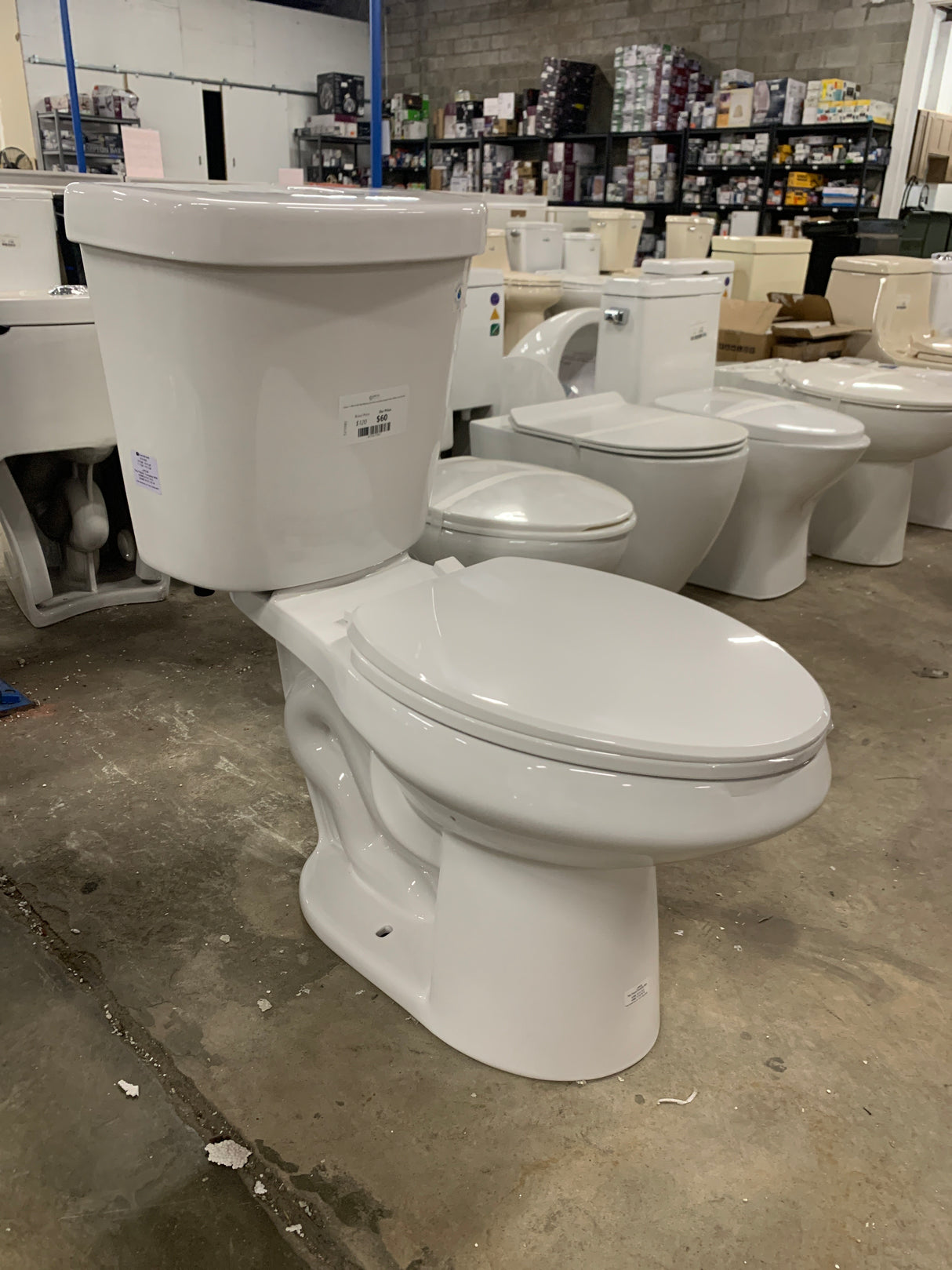 2-piece 1.1 GPF/1.6 GPF High Efficiency Dual Flush Complete Elongated Toilet in White, Seat Included