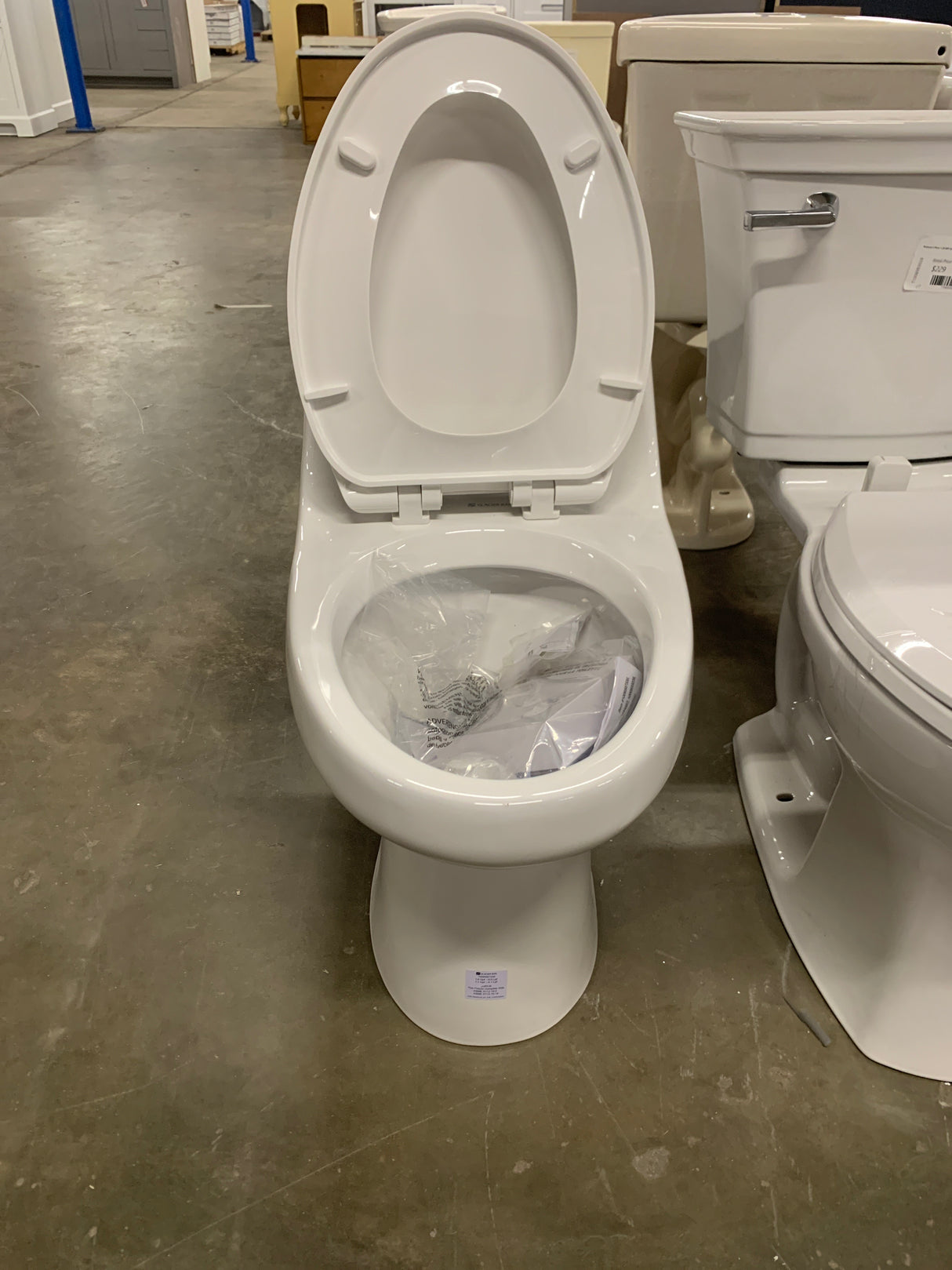 1-piece 1.1 GPF/1.6 GPF High Efficiency Dual Flush Elongated Toilet in White Slow-Close, Seat Included