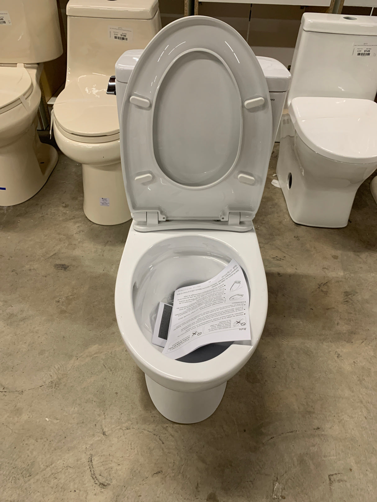 Drake 2-Piece 1.6 GPF Single Flush Elongated Standard Height Toilet in Cotton White, SoftClose Seat Included