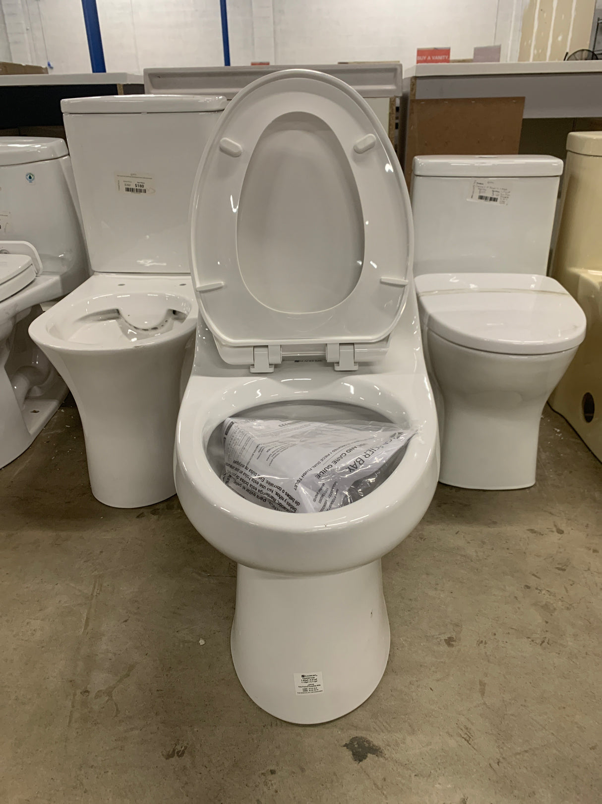 1-piece 1.1 GPF/1.6 GPF High Efficiency Dual Flush Elongated Toilet in White Slow-Close, Seat Included