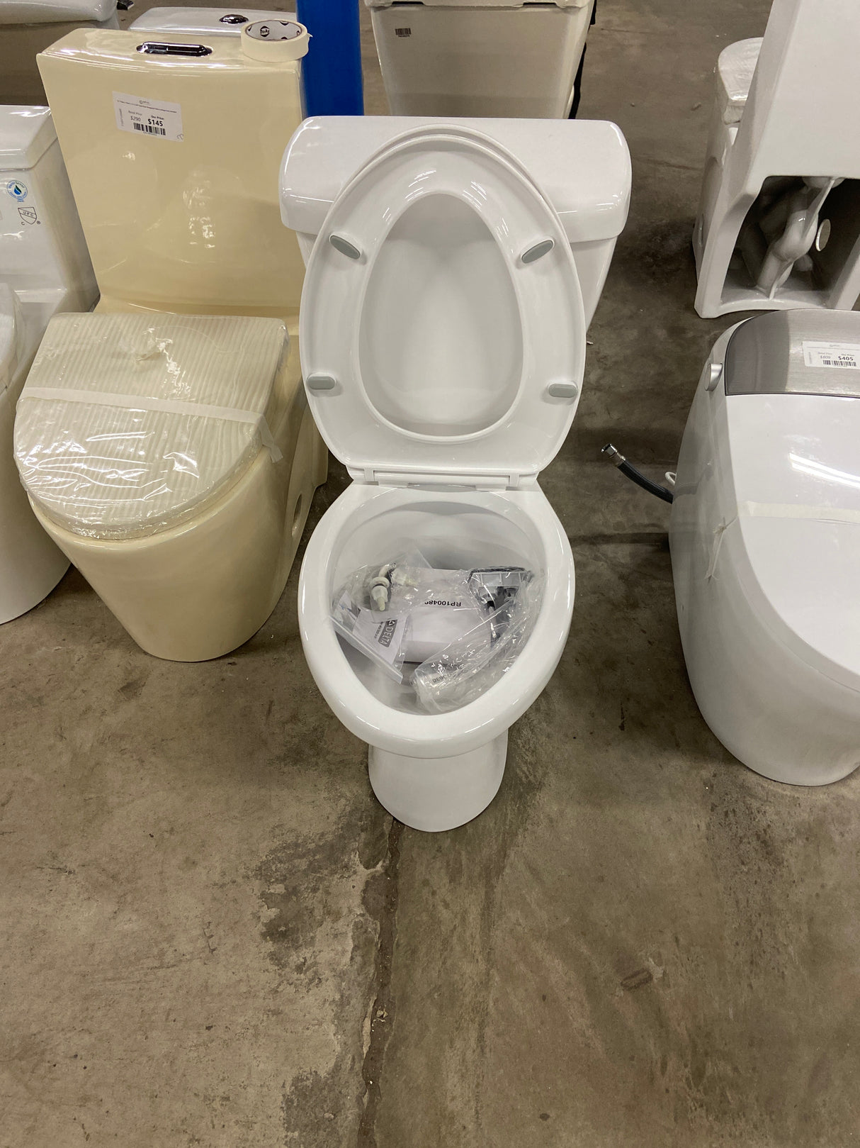 Foundations 2-piece 1.1 GPF/1.6 GPF Dual Flush Elongated Toilet in White, Seat Included