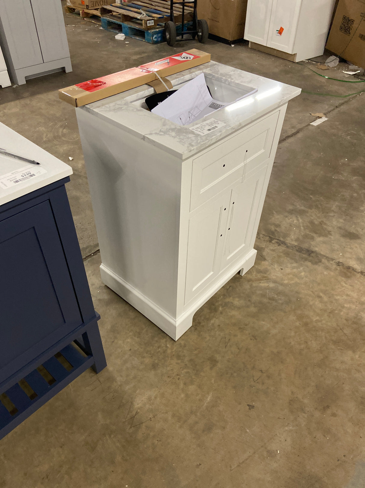 Doveton 24 in. Single Sink Freestanding White Bath Vanity with White Engineered Marble Top (Fully Assembled)