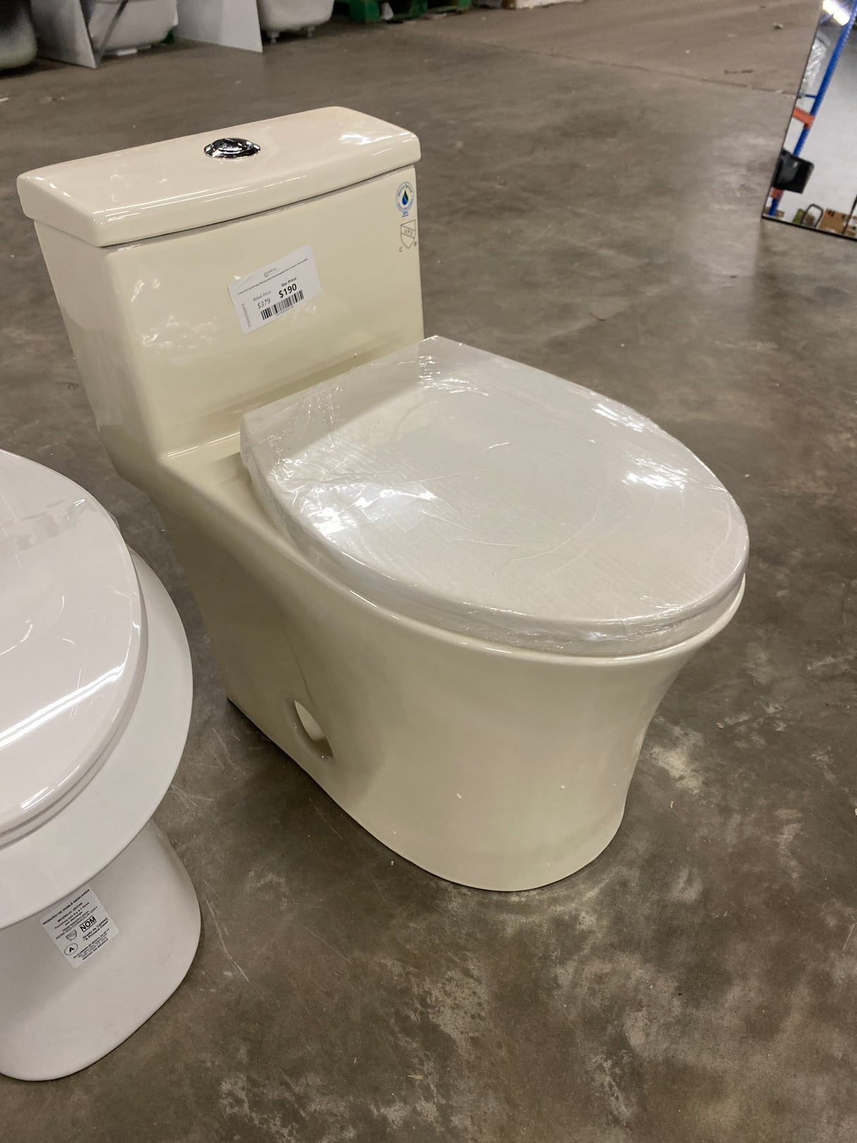 1-piece 0.8/1.28 GPF High Efficiency Dual Flush Elongated Toilet in Biscuit, Seat Included