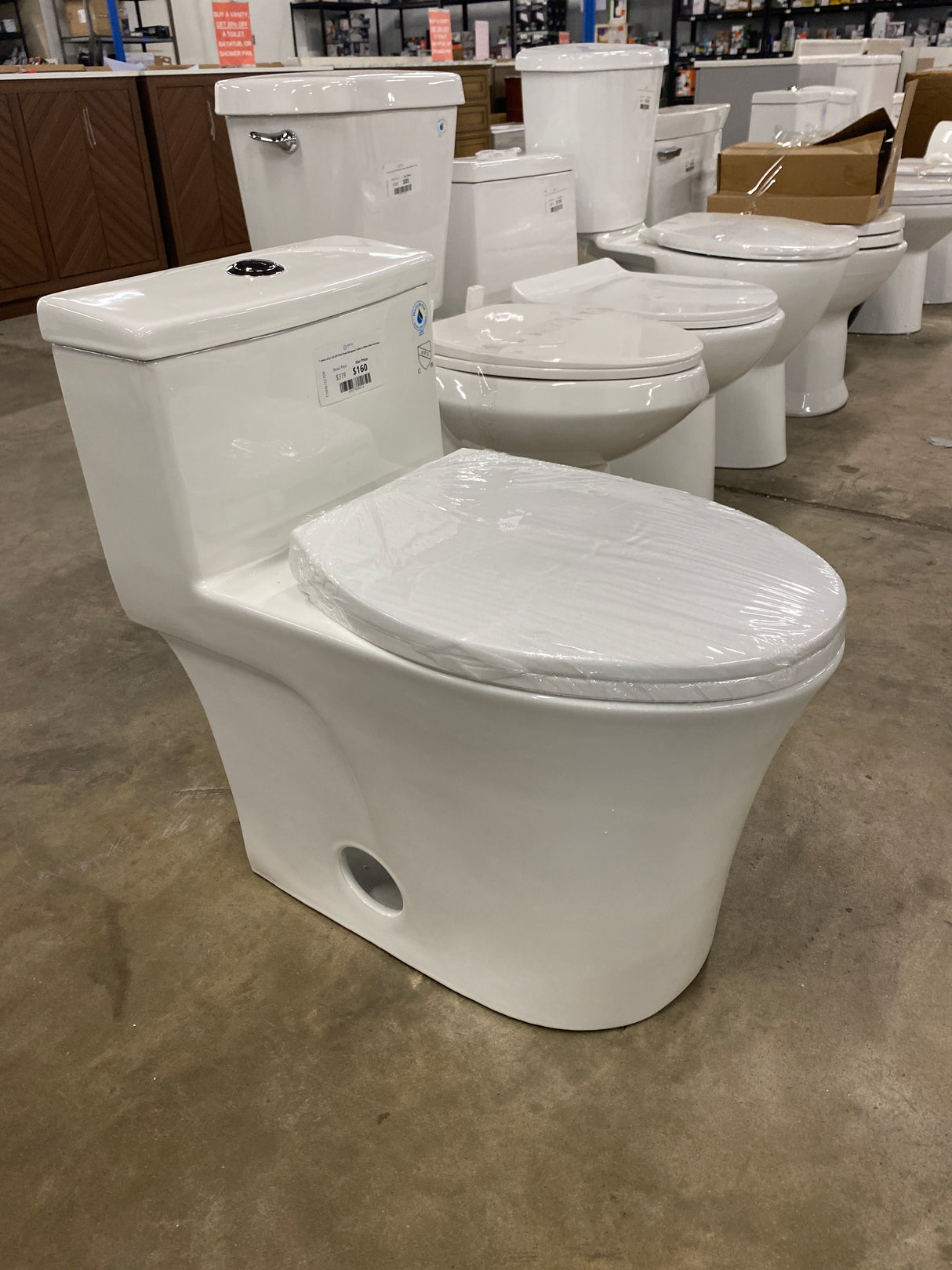 1-piece 0.8/1.28 GPF Dual Flush Elongated Toilet in White Seat Included