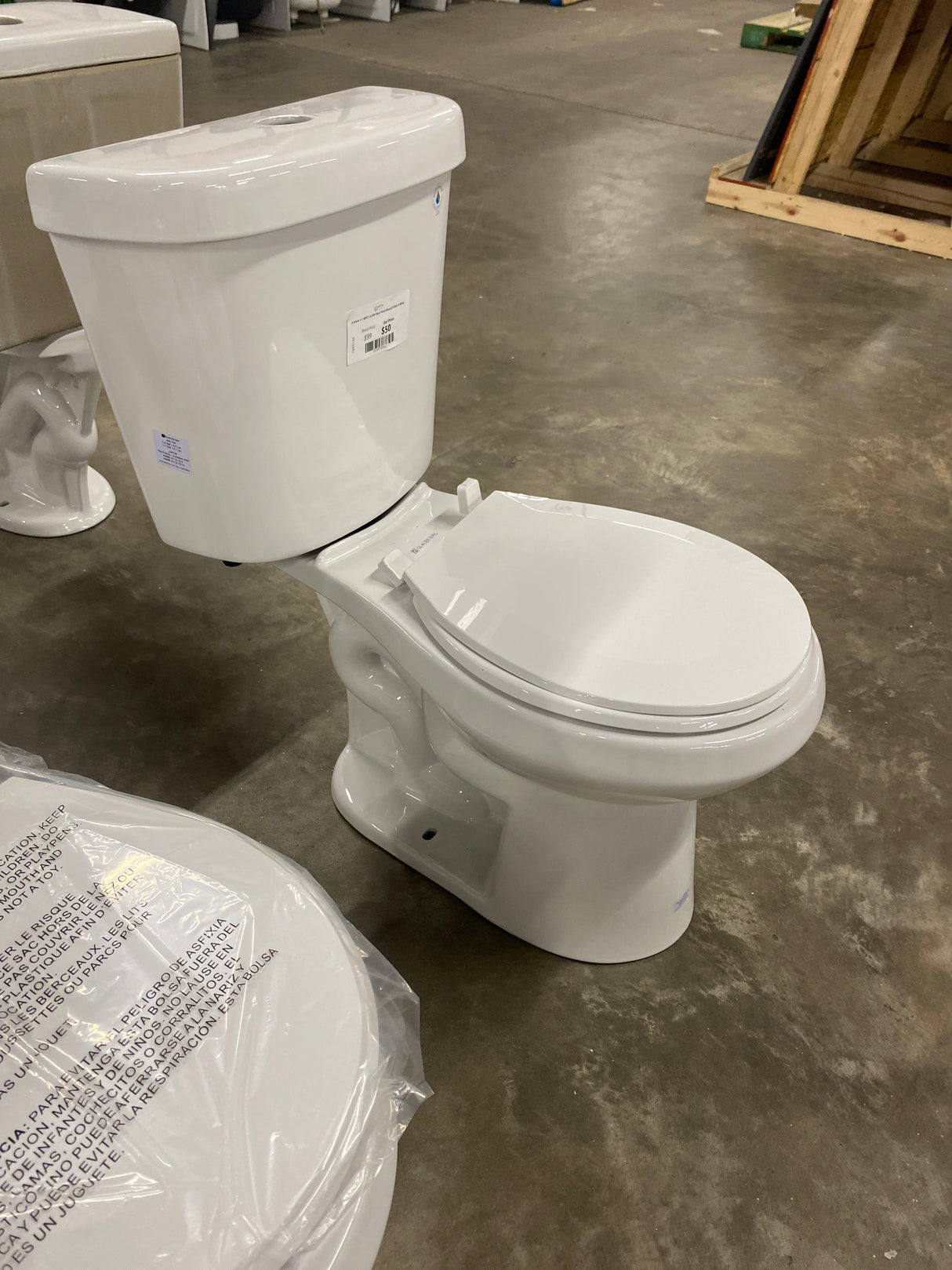 2-piece 1.1 GPF/1.6 GPF Dual Flush Round Toilet in White