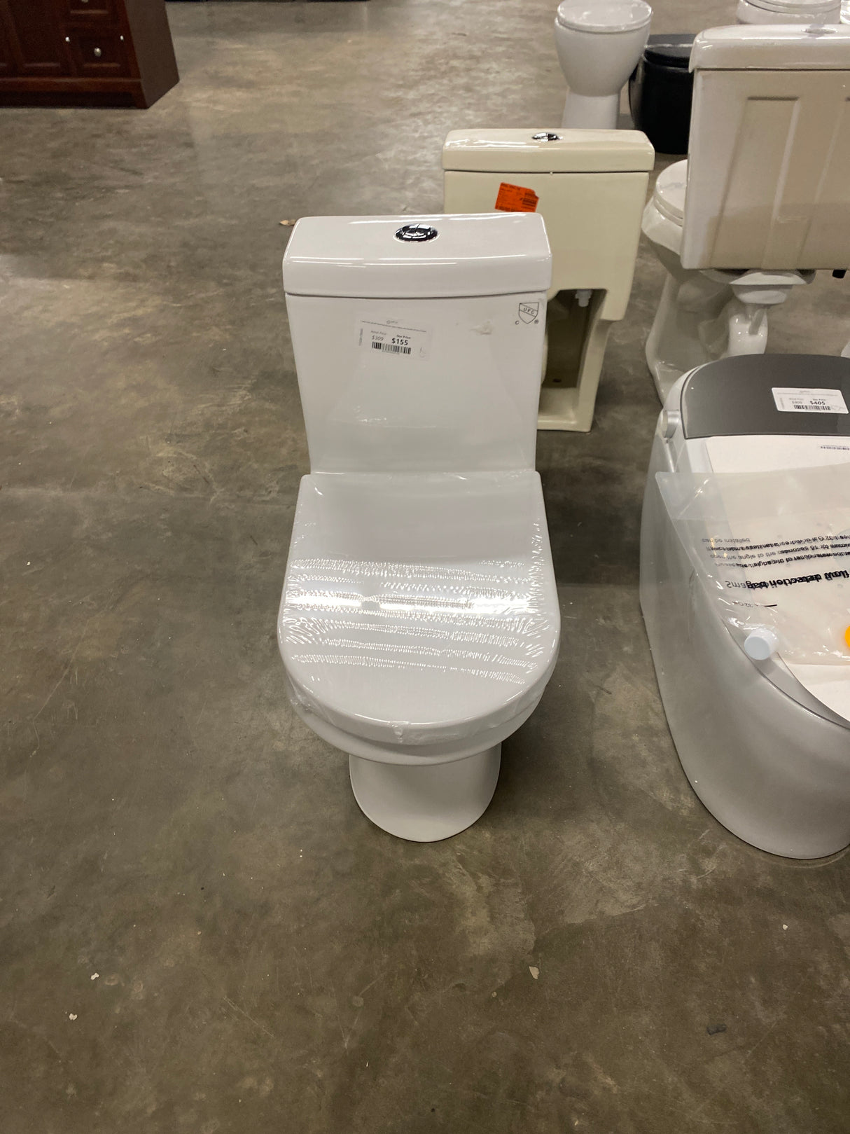 1-piece 0.8/1.28 GPF Dual Flush Round Toilet in White with Durable UF Seat Included