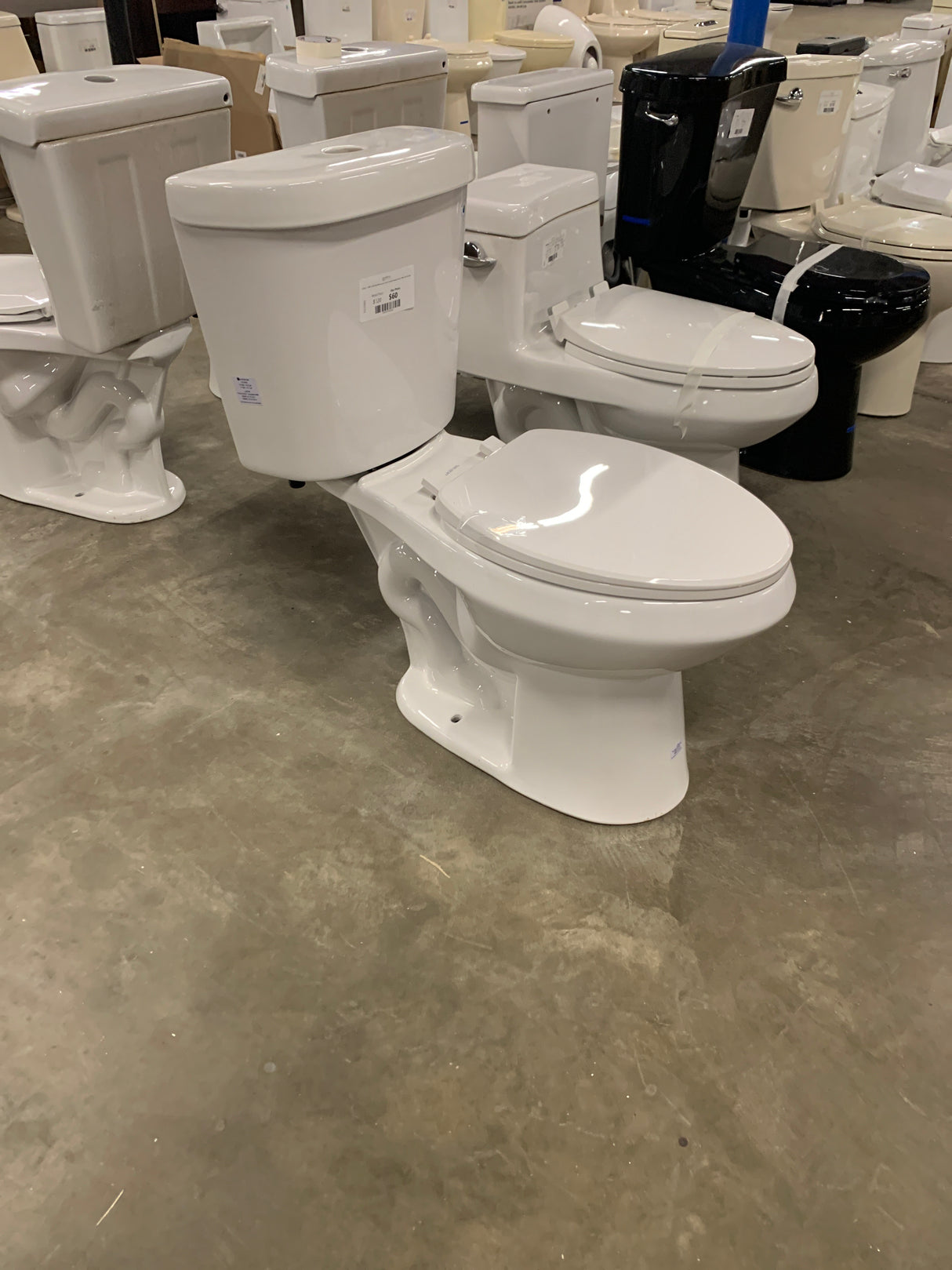 2-piece 1.1 GPF/1.6 GPF High Efficiency Dual Flush Complete Elongated Toilet in White, Seat Included