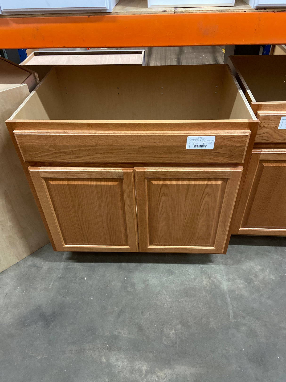 Hampton Medium Oak Raised Panel Stock Assembled Sink Base Kitchen Cabinet (36 in. x 34.5 in. x 24 in.)