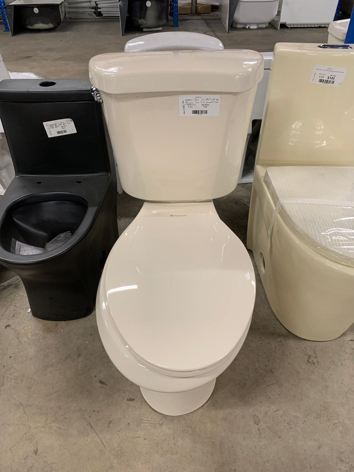 2-Piece 1.1 GPF/1.6 GPF High Efficiency Dual Flush Elongated Toilet in Bone, Seat Included